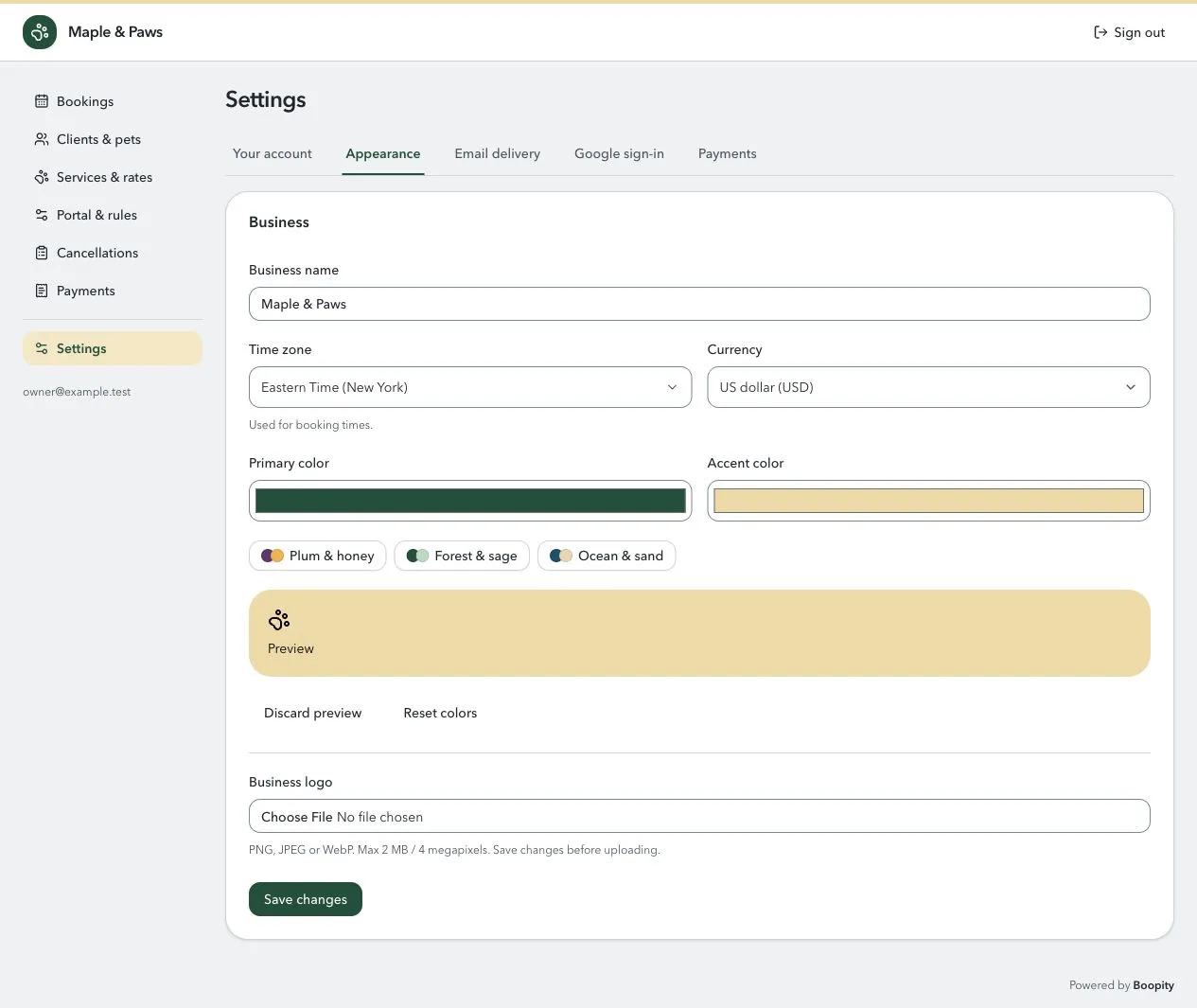 Business settings for Maple & Paws, including its name, time zone, currency, colors, and logo upload.